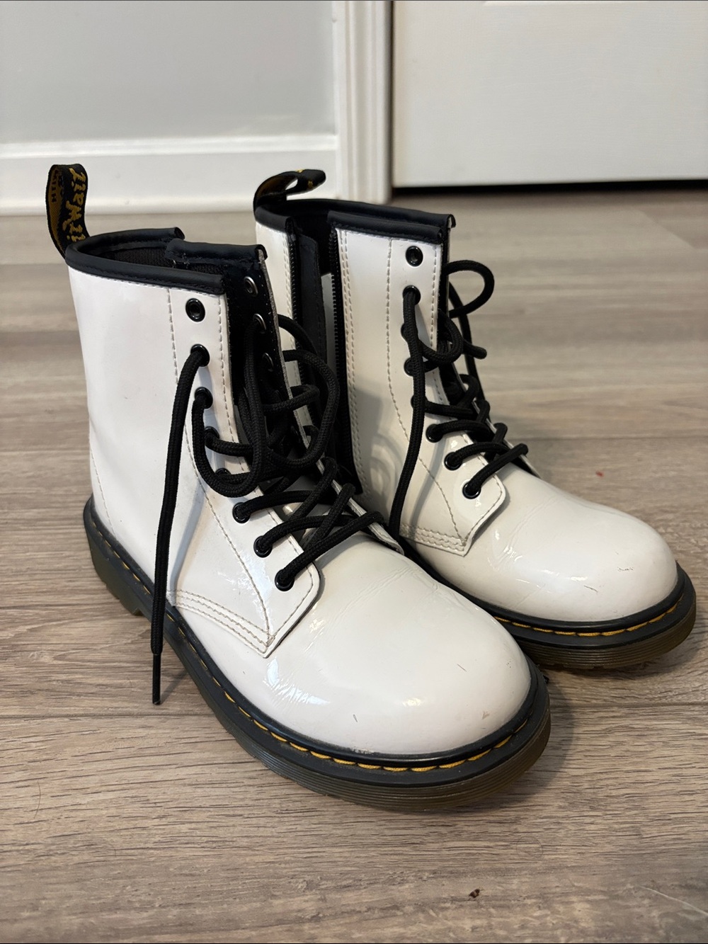 Dr. Martens White Patent Lace-Up Boots with Black Trim